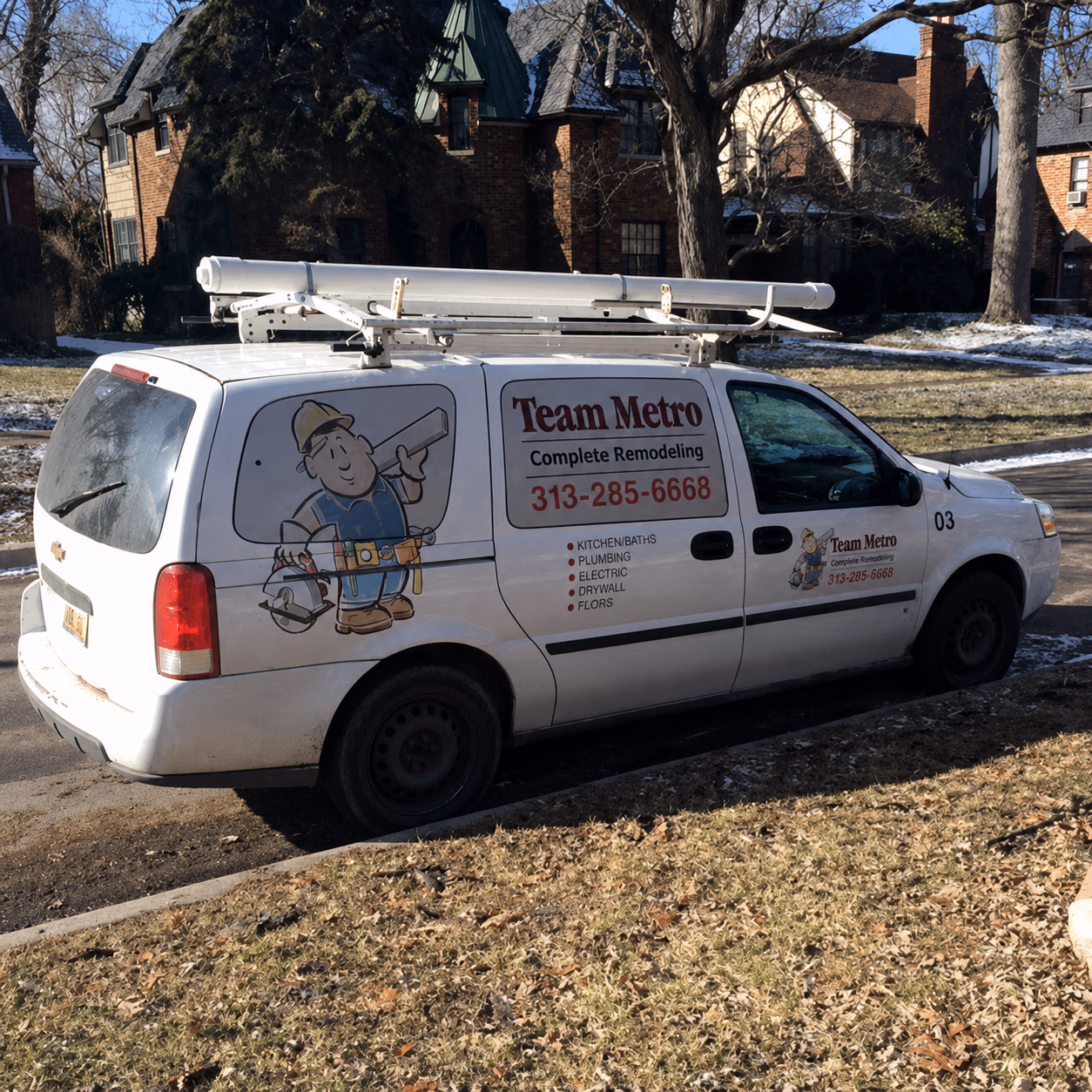 White Team Metro remodeling van parked, with ladder on top and services listed on side.